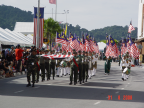 Photo of army personnel carrying the Malaysia flag